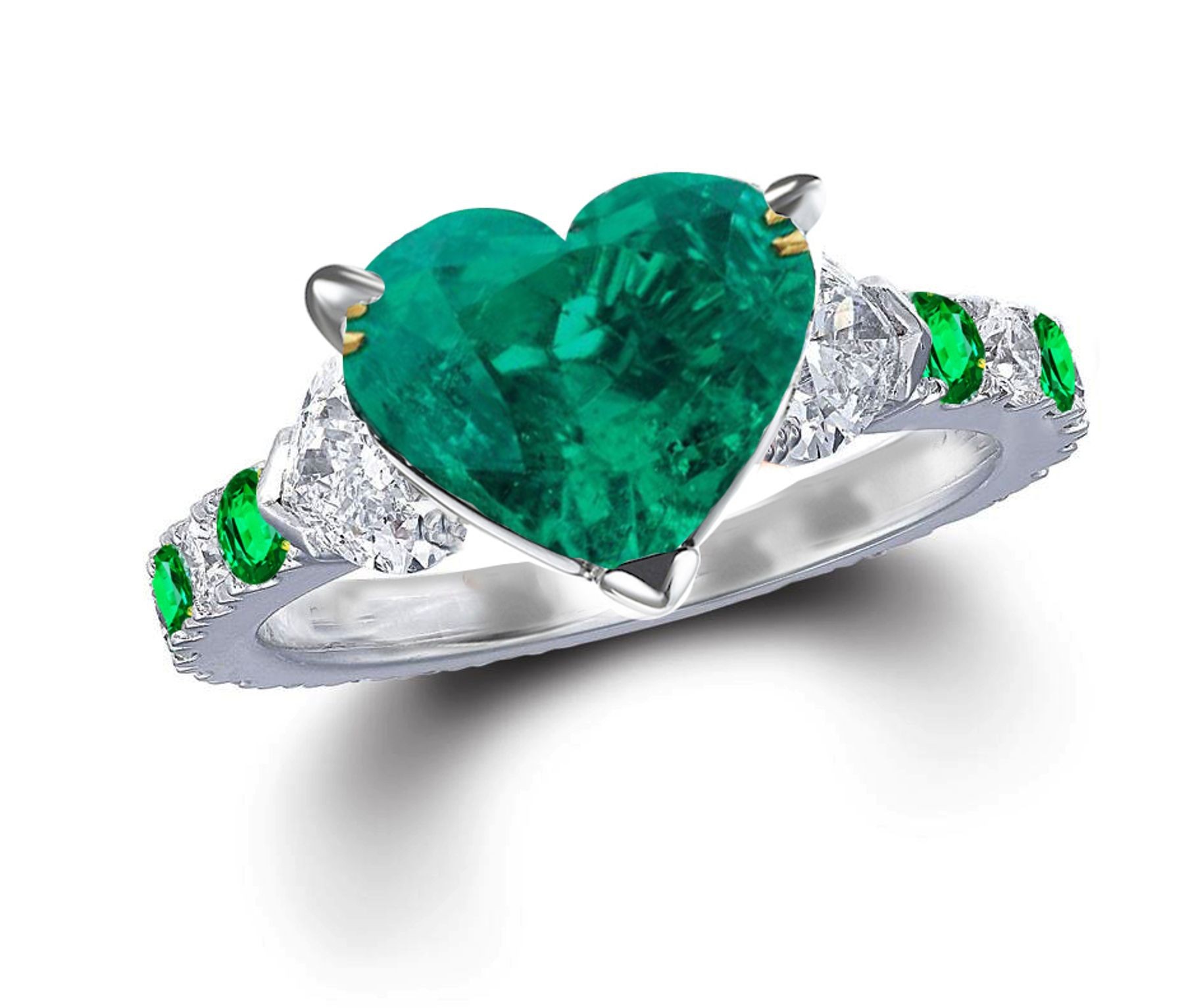 Three Stone Rings With Center Emerald & Further Diamond Accents on Sides