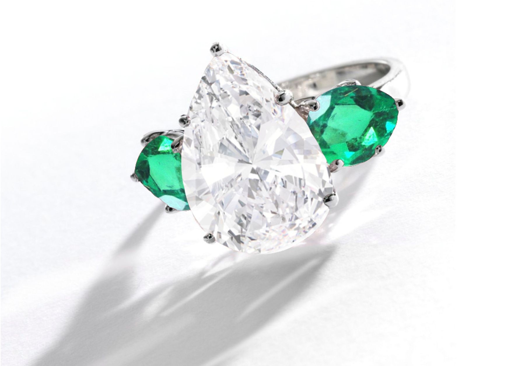 Center Pear-Shaped Diamond & Side Emeralds Three Stone Engagement Rings