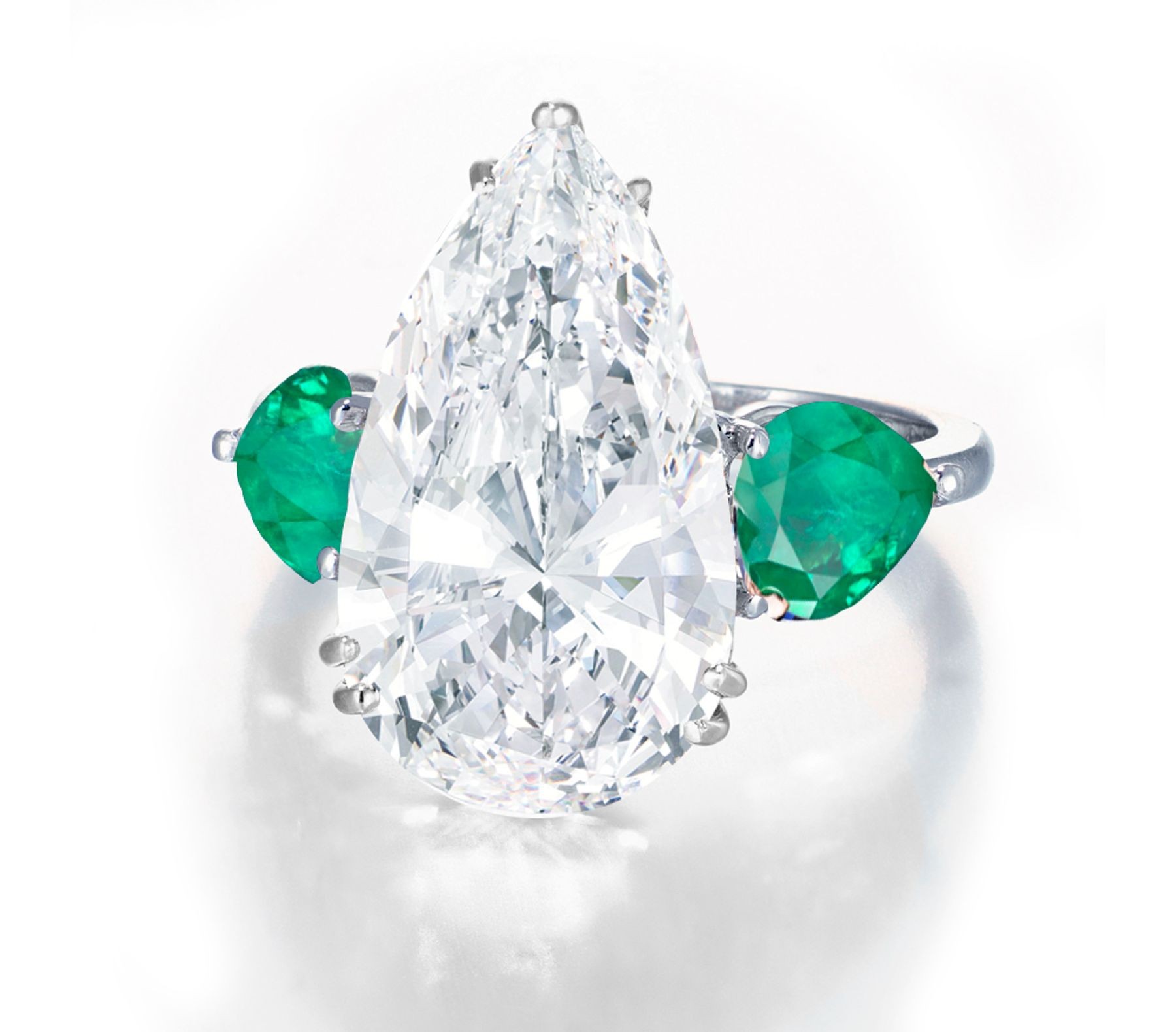 Center Pear-Shaped Diamond & Side Heart-Shaped Emeralds Three Stone Rings