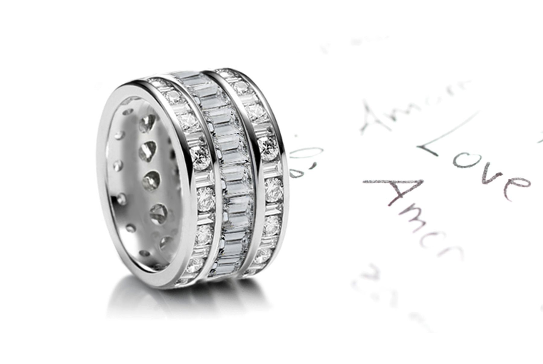 Custom Designed Sparkler of Baguette Diamonds set end-to-end bordered by row of mixed diamonds in Platinum & 14k Gold