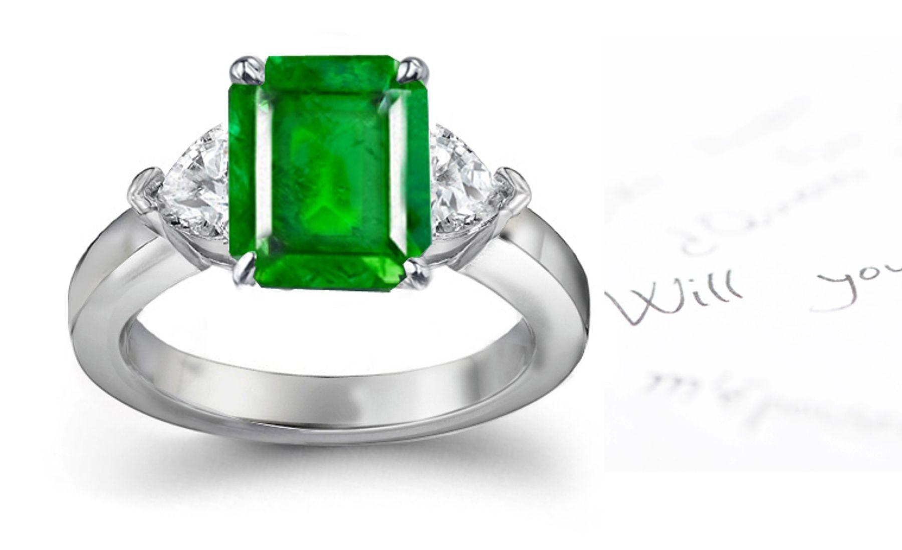 A Three Stone Heart Diamond & Emerald Cut Emerald Ring Crafted in Platinum Creating Extraordinary Visionaryl Experience