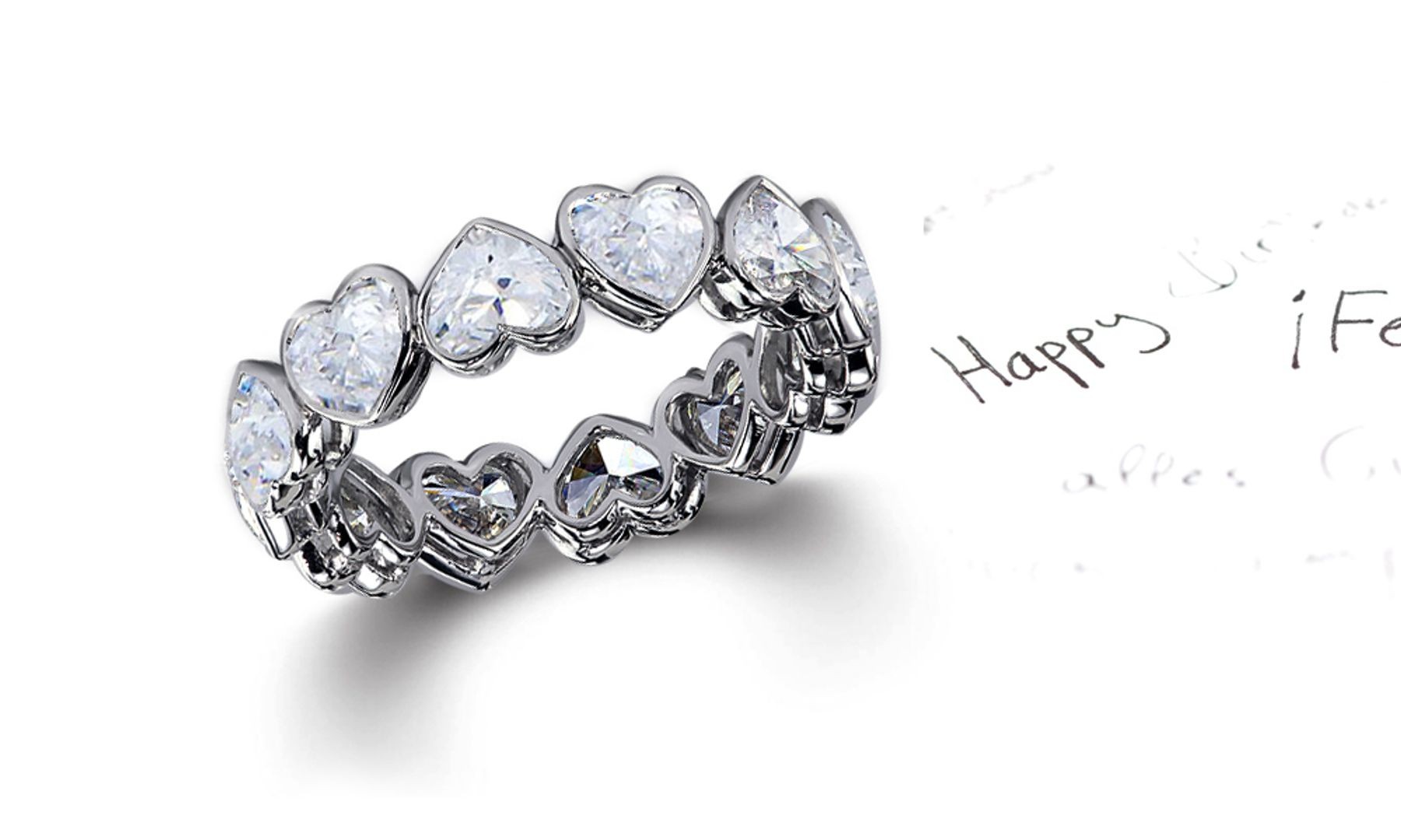Delicate Heart Shaped Diamond Bezel Set Diamond Eternity Rings in White Gold