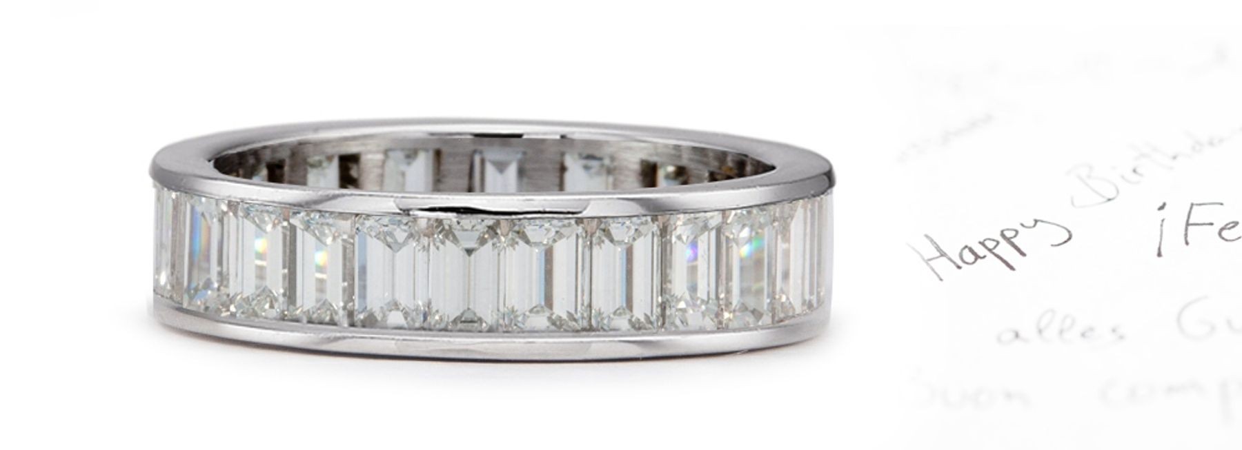 Original Designs: Exceptional Emerald Cut Diamonds Nested Channel Set Between Raised Borders