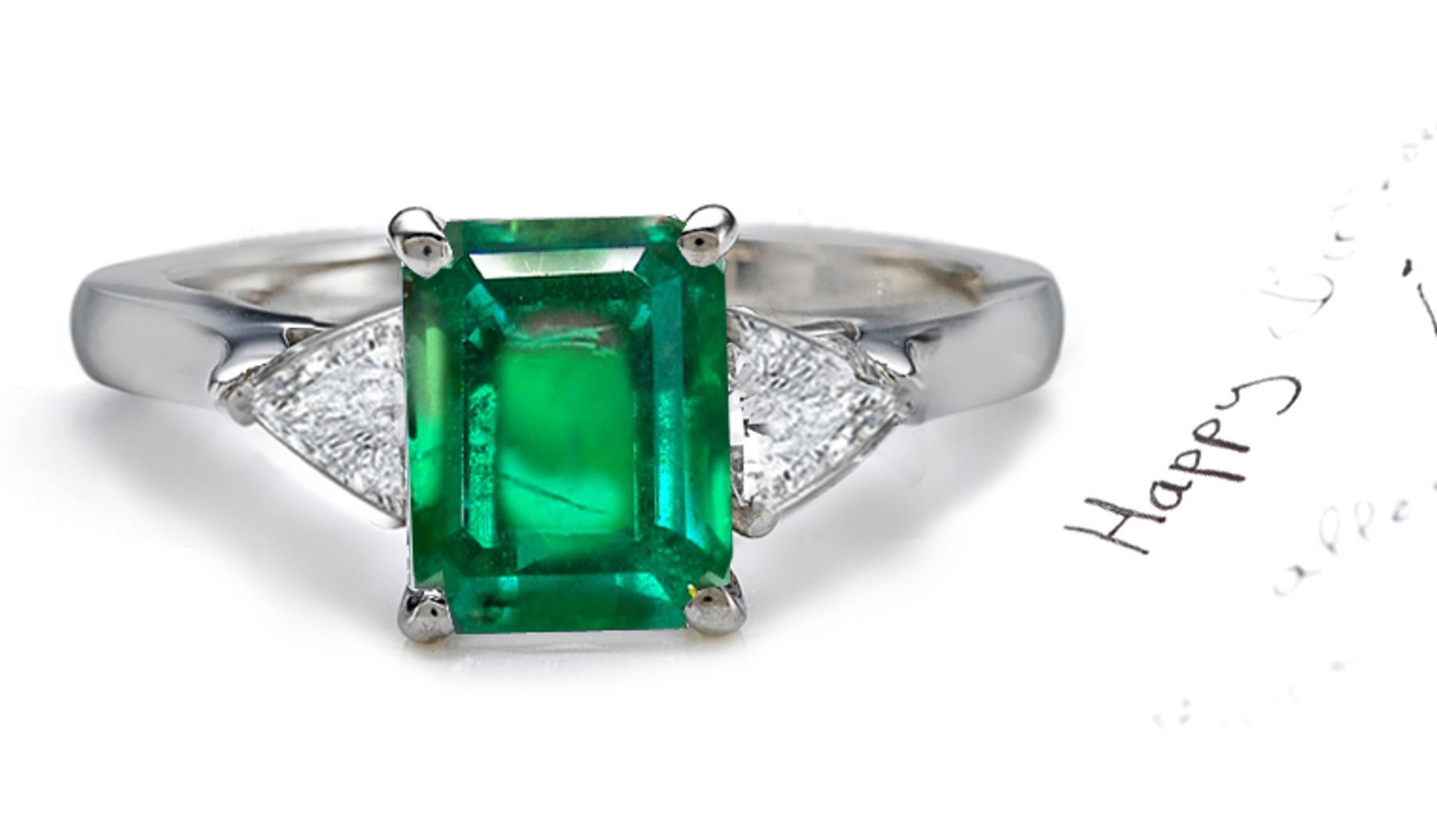 Carried in Stock: A long & ThinClassic 3 Stone Splendid Emerald Cut Emerald with Parallel Lines & Pyramid Trillion Diamond Ring in Enduring Platinum