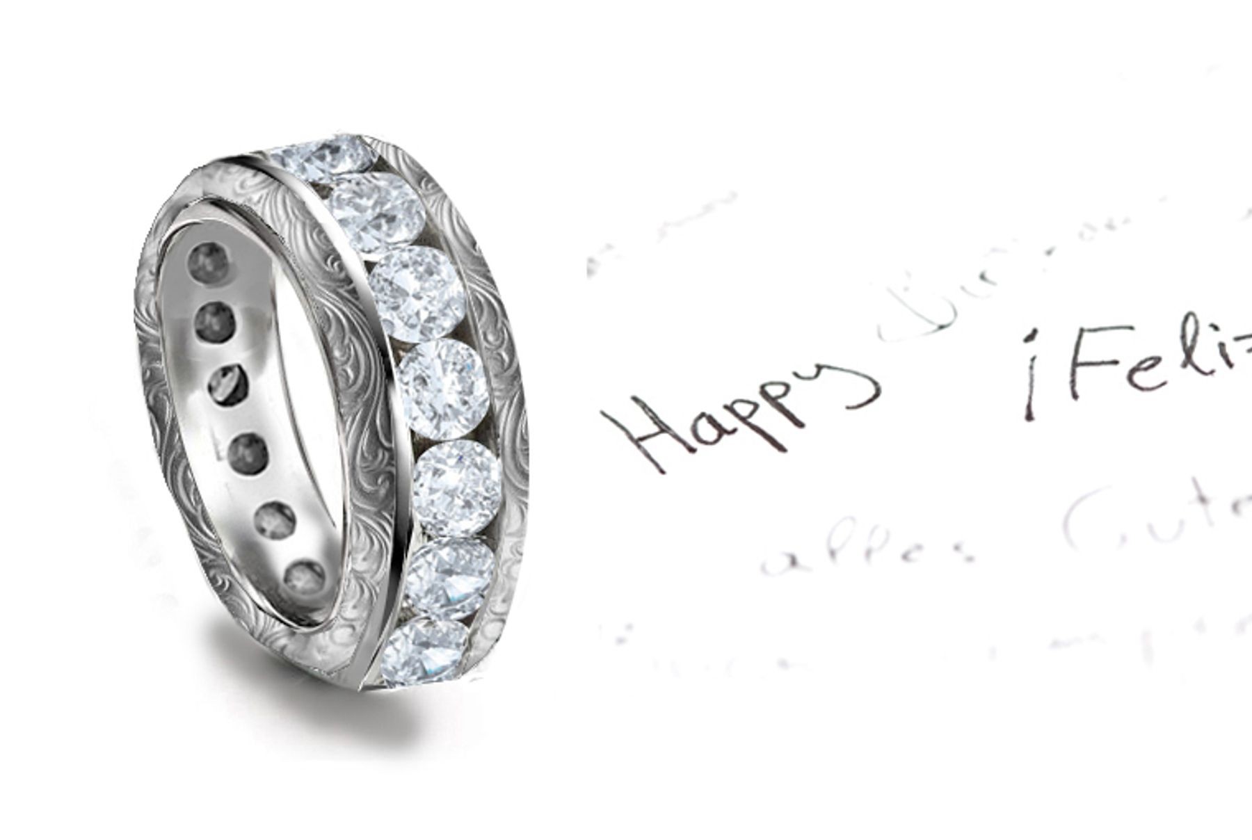 Dramatic: Twinkling Diamonds are Set across the the ring in Scrolling Motifs Gold Channel