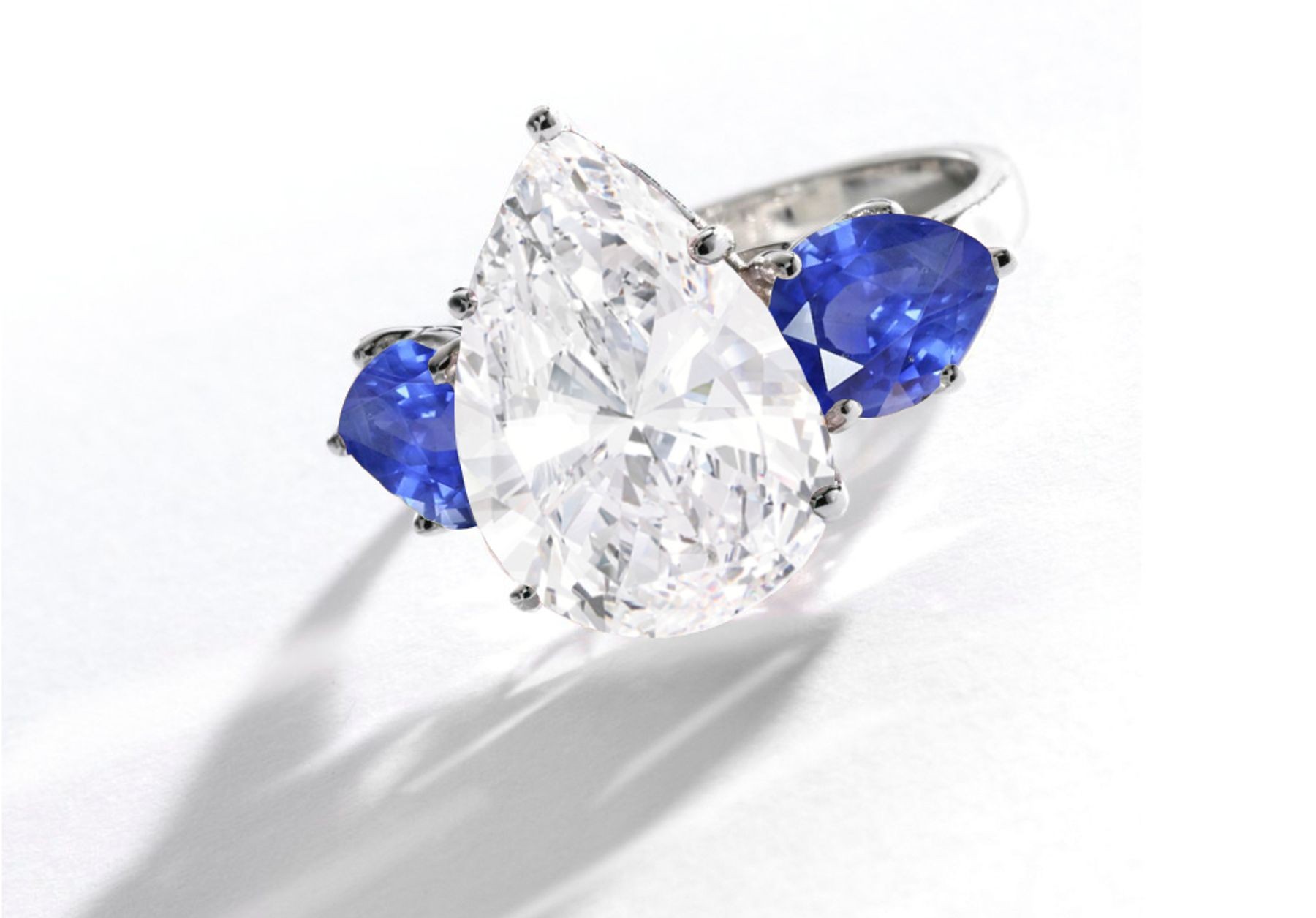 Pear-Shaped Diamond & Blue Sapphire Three Stone Engagement and Right Hand Rings