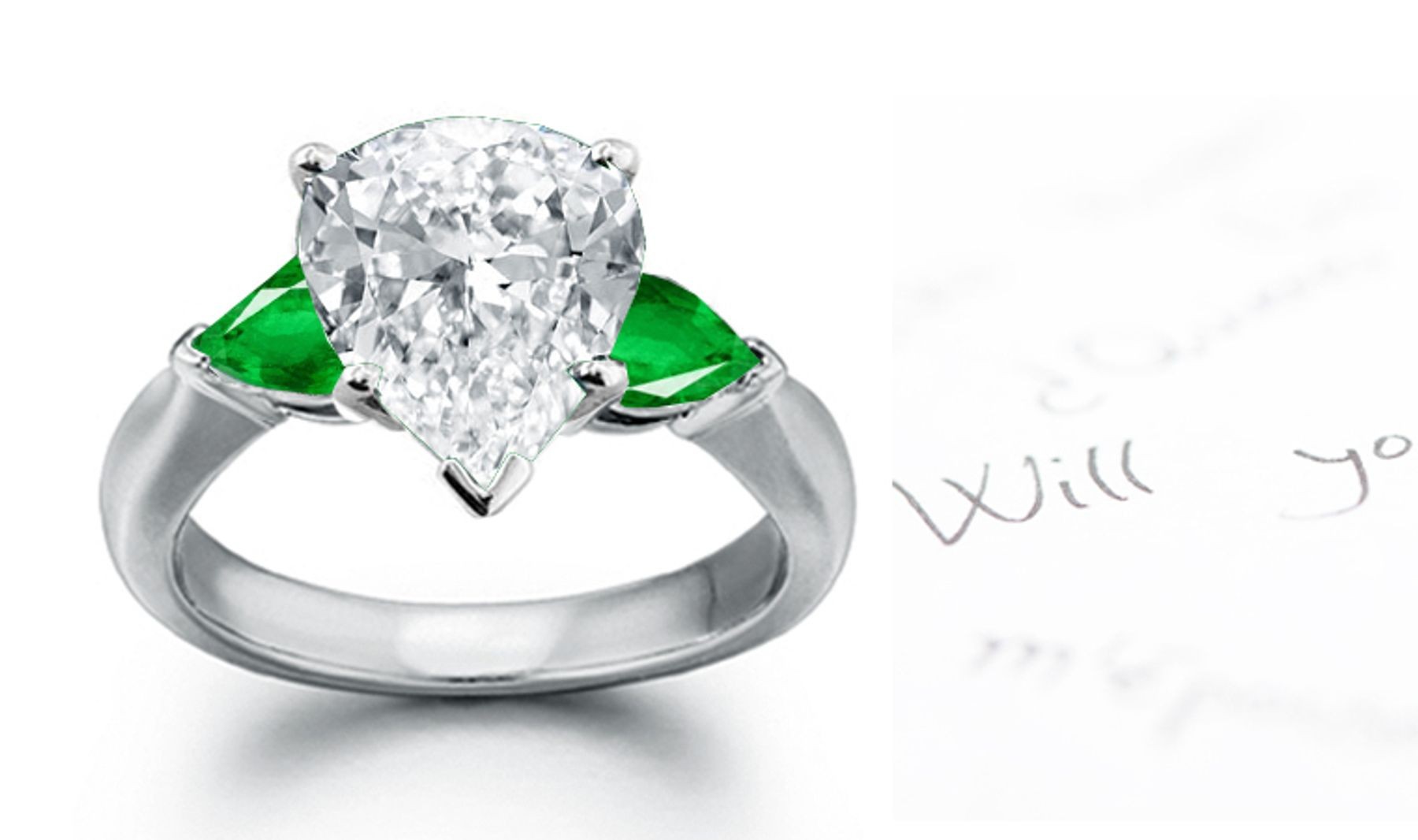 Special Designs: Half Hoop, three stones in plain platinum mounting Center pear-shaped Emerald & Diamond pear-shaped sides 