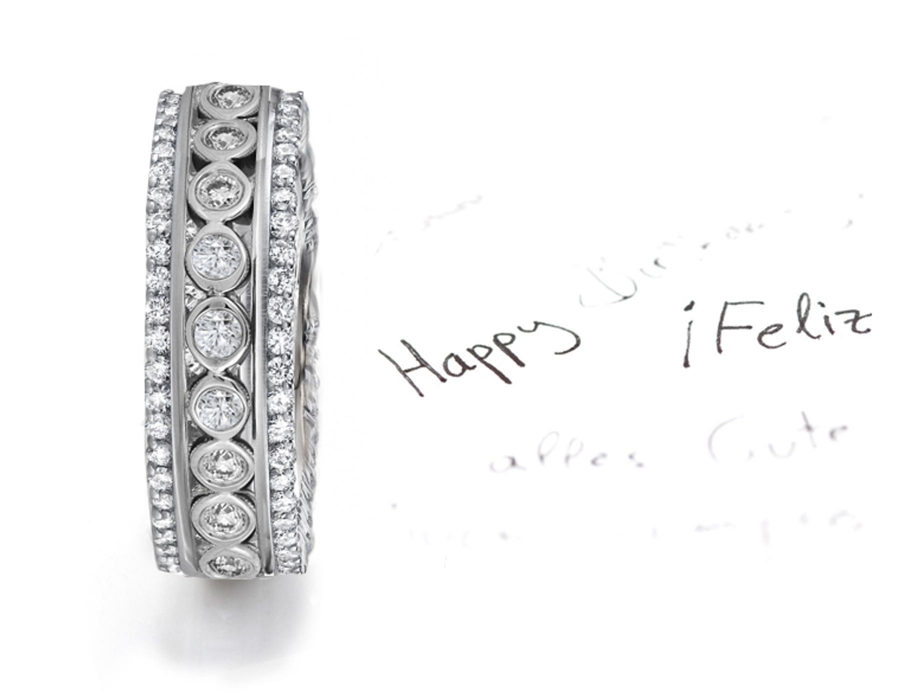 Craftsmanship: View Center Row of Bezel Set Diamonds Embraced by Row of Diamonds