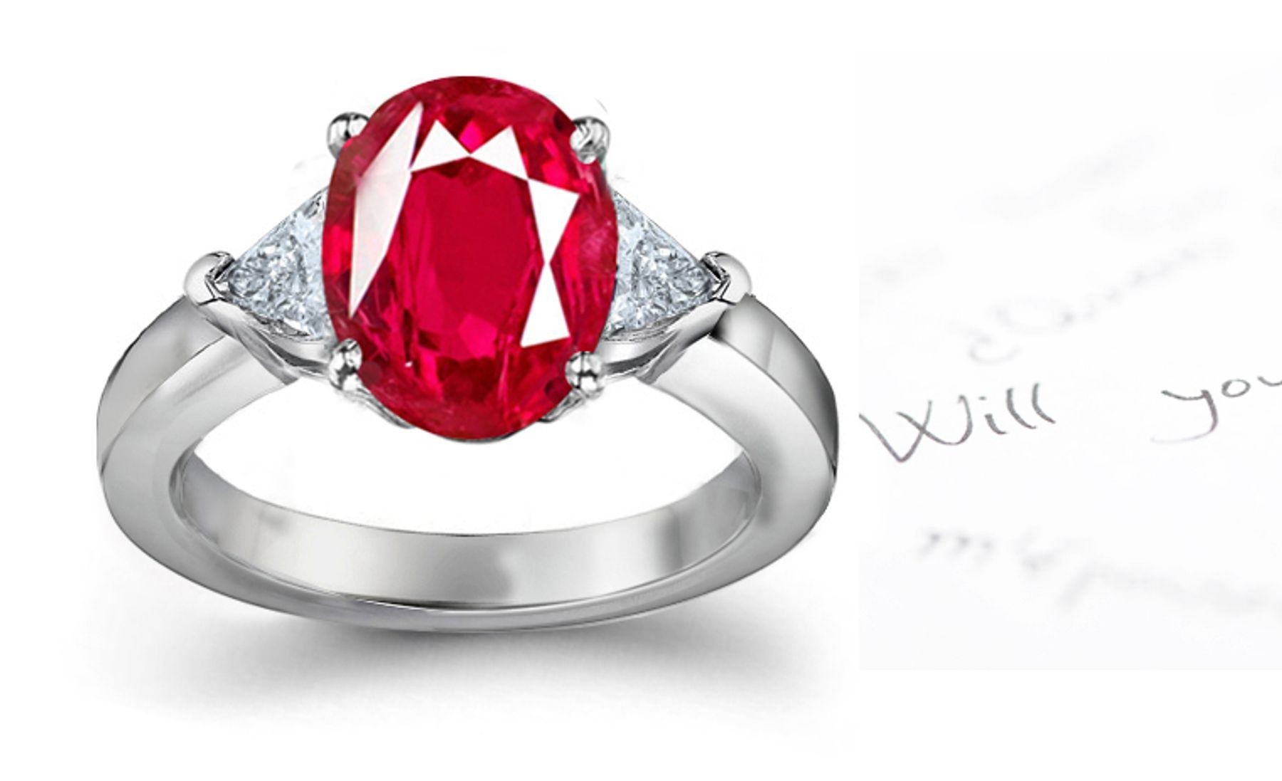 Classic Ruby Engagement Ring: Platinum ruby oval and diamond trillions three stone engagement ring.