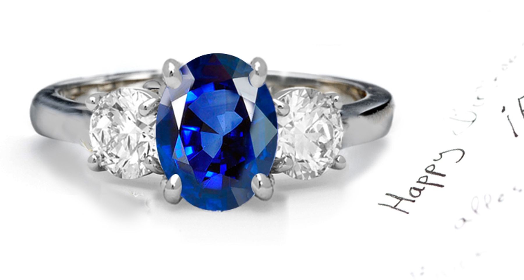 Velvetty Blue Sapphire Diamond Engagement Ring: Platinum Sapphire Oval and Diamond Rounds.