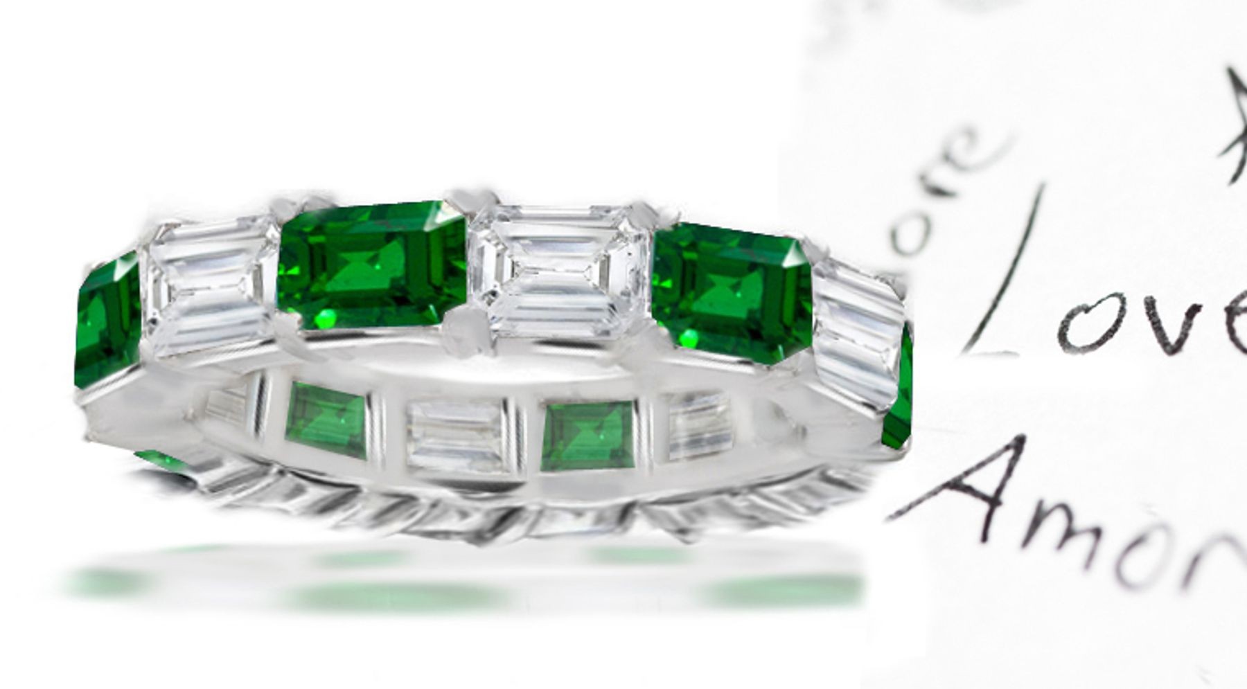 Strikingly Elegant: Emerald Cut Diamond & Emerald Band in Gold
