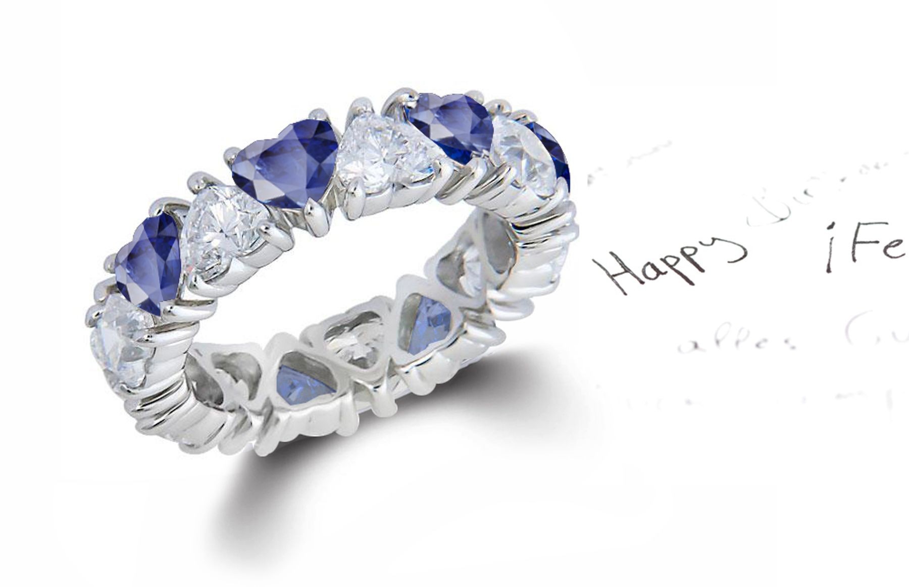 Heart Shaped Diamond Prong Set Diamond & Blue Sapphire Eternity Rings in Gold