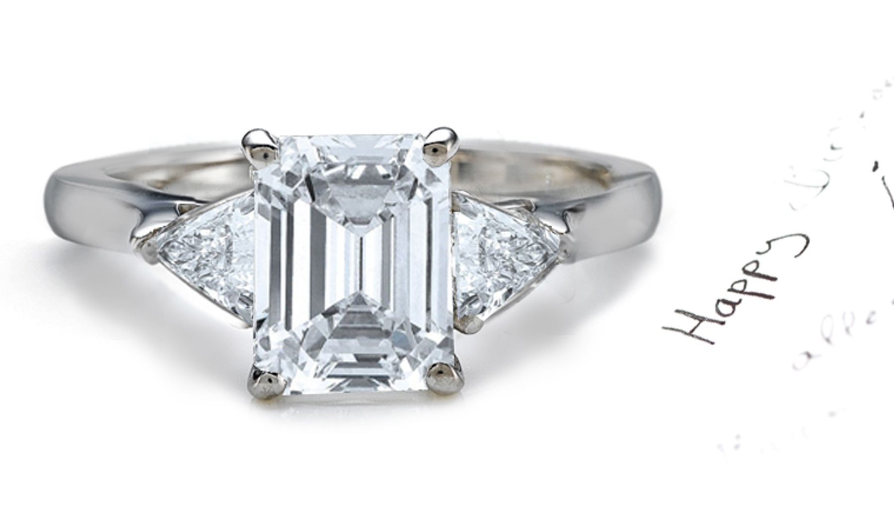 Anniversary Ring: Three Stone (Emerald Cut and Trillion Diamonds) Rings in Platinum. 