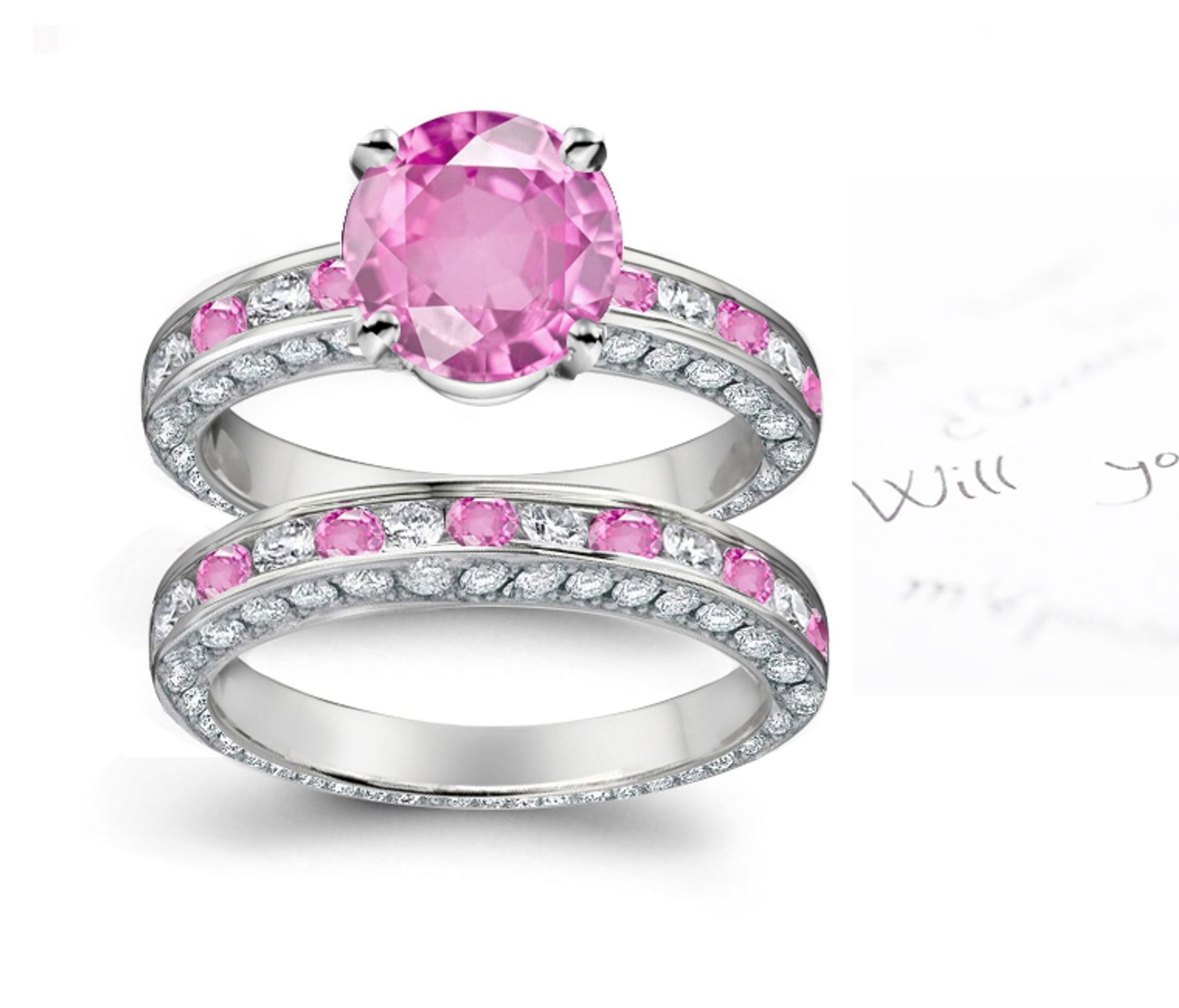 A timeless, design with a deep pink 1.0 carat round sapphire & halo of well-cut White Diamonds & Popular Sapphires in bridal set