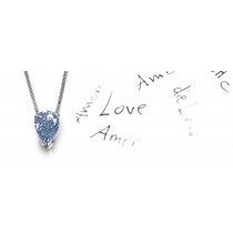 Blue Colored Diamond Pendant. Prong set pear blue diamond solitaire pendant with chain