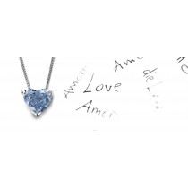 Blue Colored Diamond Pendant. Prong set heart blue diamond solitaire pendant with chain
