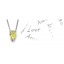 Yellow Colored Diamond Pendant. Prong set pear yellow diamond solitaire pendant with chain