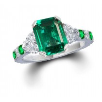 Three Stone Rings With Center Emerald & Further Diamond Accents on Sides