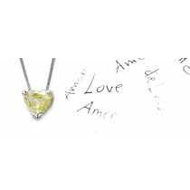Yellow Colored Diamond Pendant. Prong set heart yellow diamond solitaire pendant with chain
