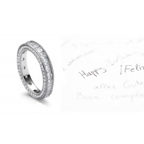 Ancient History of Beauty: Glittering Asscher Cut Diamonds are Channel Set with Spiraling Motifs on Platinum Band Sides