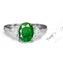 A Special Gift: Center Oval Emerald & Side Matched Heart Brilliant Diamond Three Stone 2 Side Stone Platinum Hoop Ring