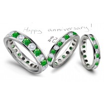 Strikingly Elegant: Channel Set Diamond & Emerald Eternity Wedding Band in Platinum 