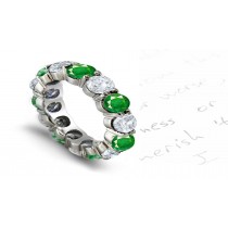 Classic Brilliant Cut Round Diamond & Bluish Green Emerald Shared-Prong Eternity Ring in Gold