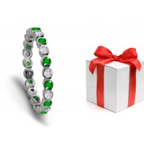 Sparkling: Bezel Set Emerald & Diamond Eternity Ring in Platinum