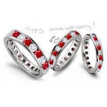 Eternity Rings: Platinum channel set round rubies and diamonds eternity band