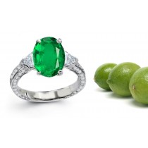 Three Stone Diamond Rings Features Center Oval Emerald with Trillion Diamond side stones