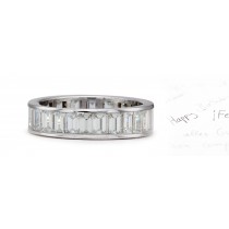 Original Designs: Exceptional Emerald Cut Diamonds Nested Channel Set Between Raised Borders