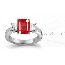 Ruby Ring: Platinum ruby oval and diamond pear shaped three stone anniversary ring or engagement ring.