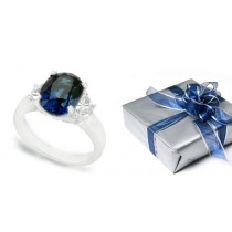 Oval Blue Sapphire Three Stone Ring with Half-Moon Diamonds in 14k White Gold (7x5 & 5x3 mm)