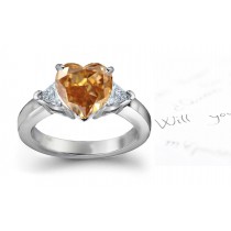 Sparkling Center Heart Brown Diamond & Pair of Trillion White Diamonds Accented Gold Engagement Ring