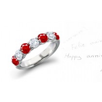 Anniversary Wedding Rings: Ruby diamond ring in platinum set with four round rubies and three round diamonds.