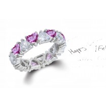 Heart Shaped Diamond Prong Set Diamond & Pink Sapphire Eternity Rings in Gold