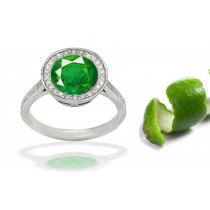 Ascent and Descent: Bezel & French Pave Set Diamond Halo Surrounding The Center Round Richly Cut Green Emerald