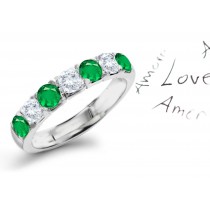 Excitement & Magic: 7 Stone Emerald & Diamond Anniversary Ring