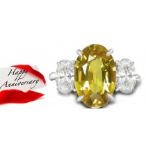Oval Yellow Sapphire with Oval Diamonds in 14k White Gold Engagement Ring (7x5 mm)
