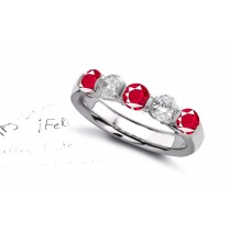 Ruby Five Stone Rings: Ruby diamond ring in platinum set with three round rubies and two rounddiamonds