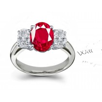 Crimson Red Ruby & Diamond Engagement Ring: Platinum ring with round center diamond & two side round brilliant rubies.