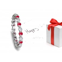 Fascinating: Bar Set Round Ruby & Diamond Eternity Band in Polished Platinum & 14k Gold