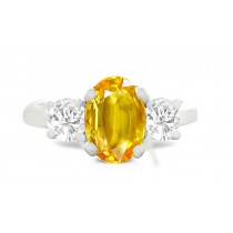 A collection of beautiful, exclusive and extraordinary items to satisfy the most singular of tastes. Oval Yellow Sapphire with Round Diamond in Platinum & 14k White Gold Ring