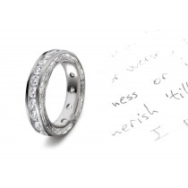 Diamonds Create Drama: View This Illuminating Engraved Motifs Decorate the sides of this Diamond Eternity Wedding Band