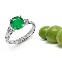 Plain Skeleton Mountings: This Three Stone Ring Features Trillion Diamonds & A Round Emerald Stone