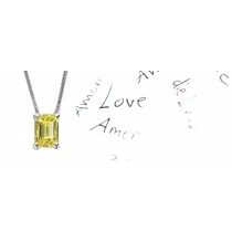 Yellow Colored Diamond Pendant. Prong set emerald cut yellow diamond solitaire pendant with chain