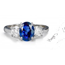 Velvetty Blue Sapphire Diamond Engagement Ring: Platinum Sapphire Oval and Diamond Rounds.