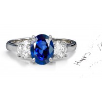 Velvetty Blue Sapphire Diamond Engagement Ring: Platinum Sapphire Oval and Diamond Rounds.