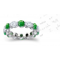 Dramatic Emerald Jewelry Eternity Rings: Well crafted round emeralds & diamond bar set in alternating fashion with colorless minimal flaw diamonds in gold or platinum settings.