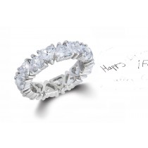 Heart Shaped Diamond Prong Set Diamond Eternity Rings in Gold or Platinum